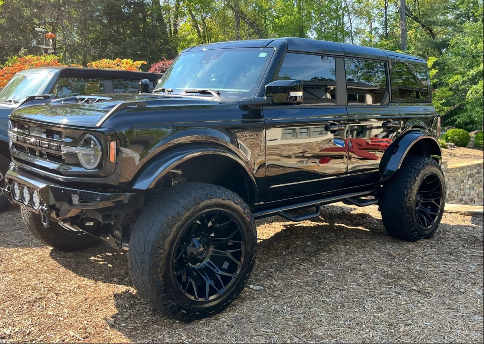 Black lifted Ford Bronco detailed by PureRide in Olathe — deep gloss black paint after a full exterior detail.